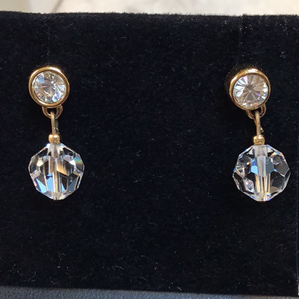 Crystal ball hanging from a bezel set rhinestone, pierced earrings